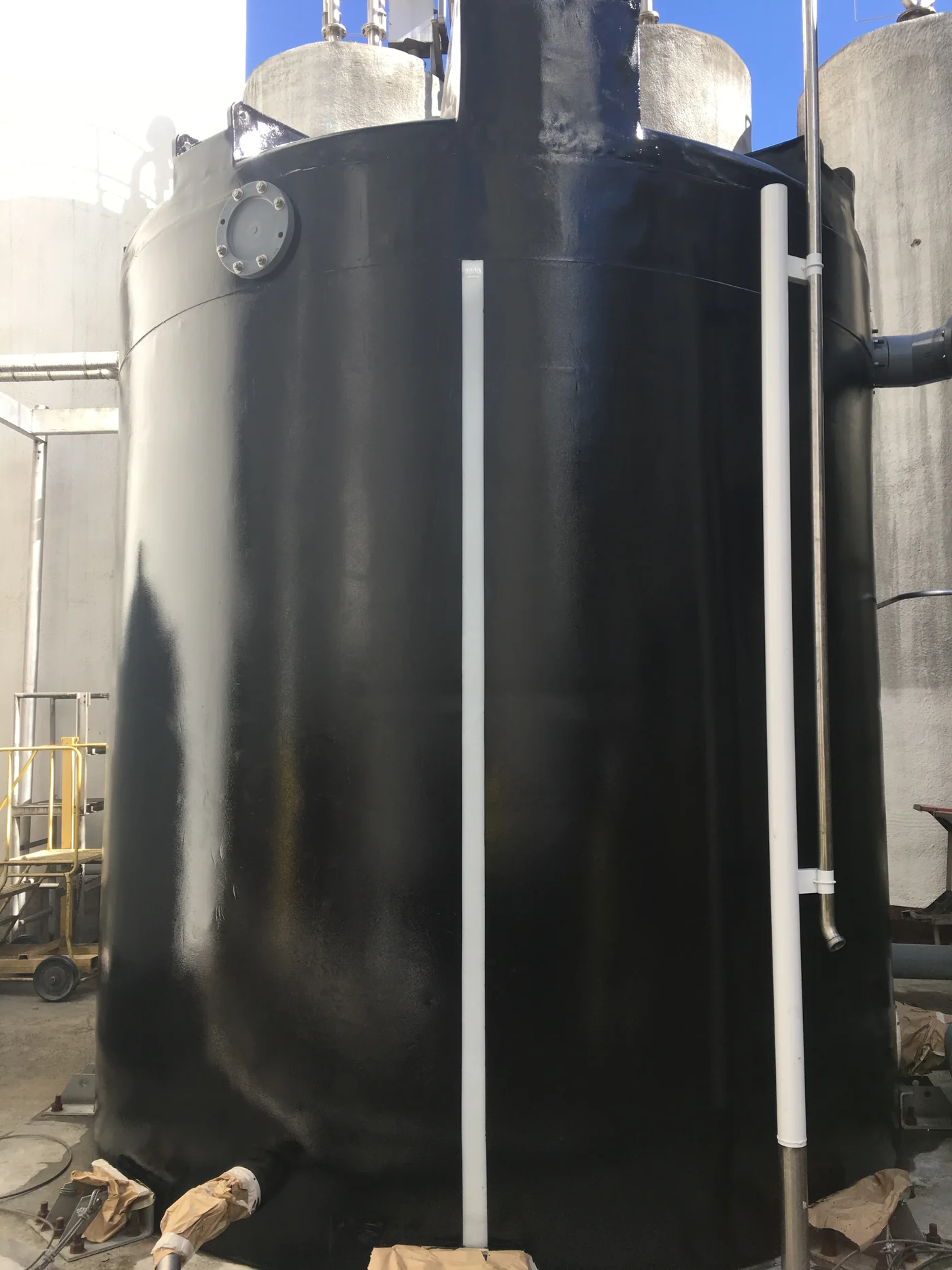 Concentrate tank after black protective coating by Gold Star Painting