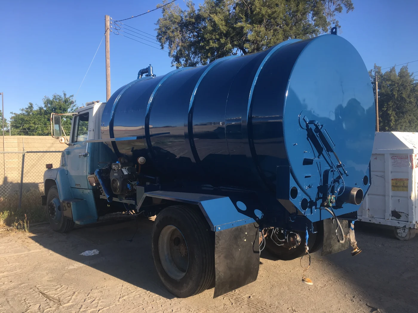 Refinished vacuum truck tank with a fresh protective coating